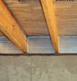 SilverGlo™ insulation installed in a floor joist in Grand Haven