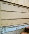 an old-fashioned crawl space door in Ludington about to be replaced