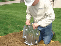 Fastening an earth anchor for a severely bowing wall in Jackson.