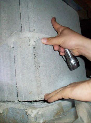 a completely failing concrete crawl space support pillar in Allegan