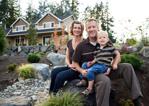 A happy family outside a home with a repaired foundation in Manistee