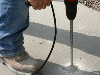 Concrete Leveling drilling hole to fill with PolyLevel