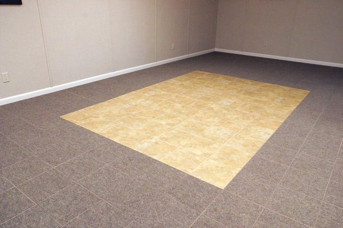 tiled and carpeted basement flooring installed in a Battle Creek home