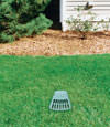 A buried gutter drain downspout extension installed in a Allegan home
